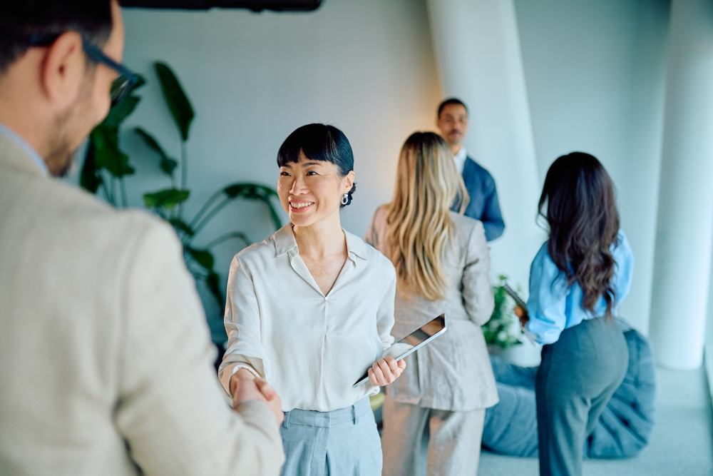 Diverse,Business,Professionals,Shaking,Hands,During,A,Meeting,,Representing,Successful